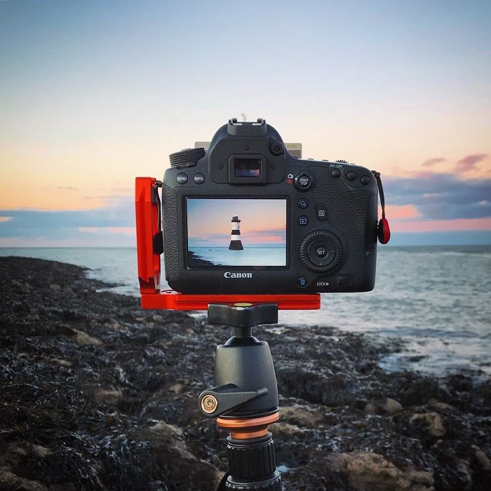 Photo of lighthouse shore landscape seen through viewfinder