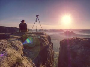 Sunrise mountain photographer tripod