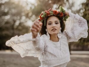 Portrait of a woman in a white dress with a flower crown as a DIY photography prop