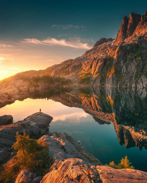 Edited landscape of a mountain lake at dusk