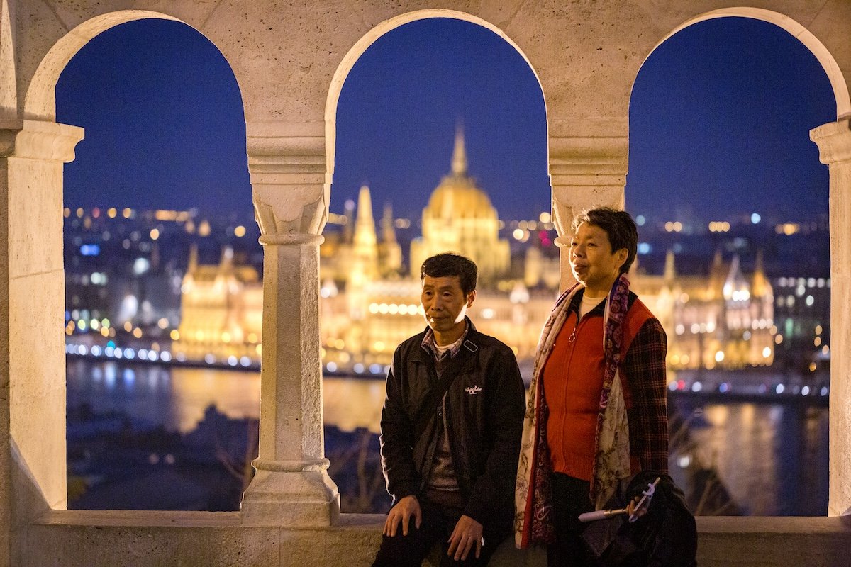 photograph of couple sitting with a view behind them edited in lightroom