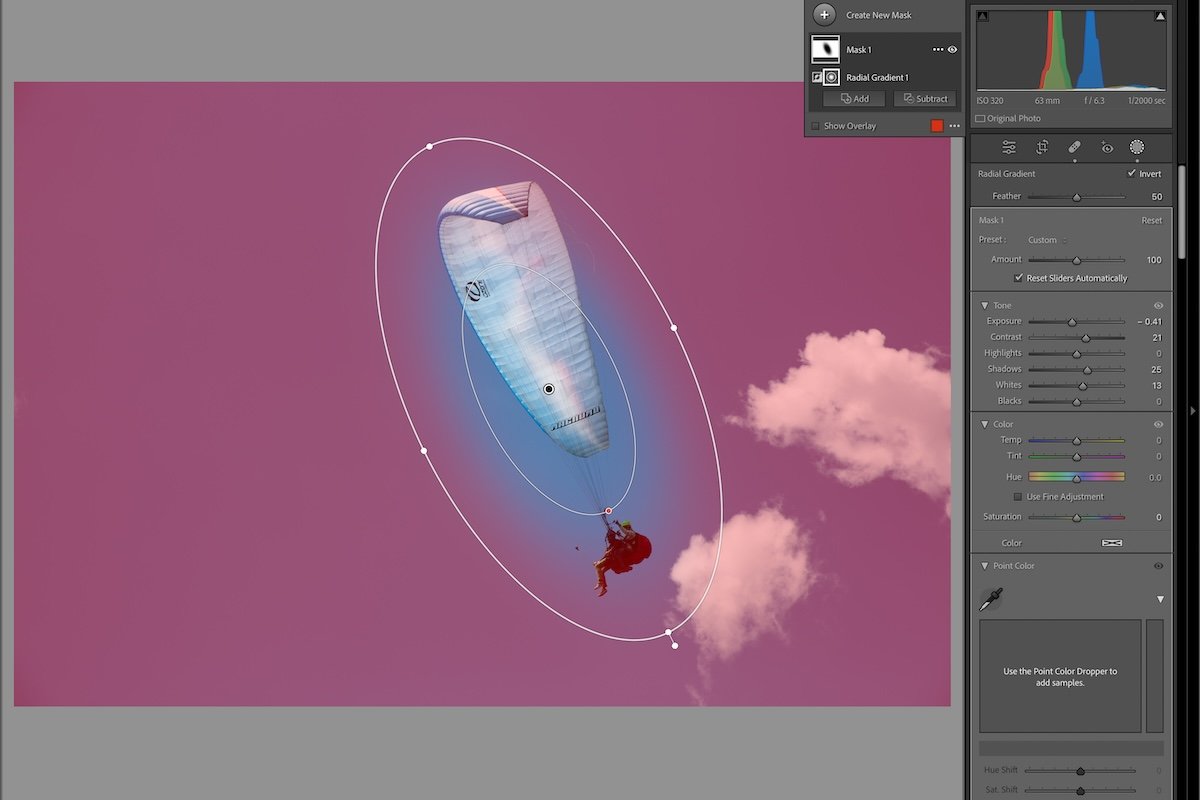 photograph of a paraglider in the air with an inverted radial gradient in lightroom