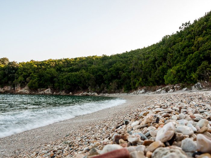 Waves breaking on the shore of Avlaki beach (Kerkyra, Greece), using motion blur in the waves