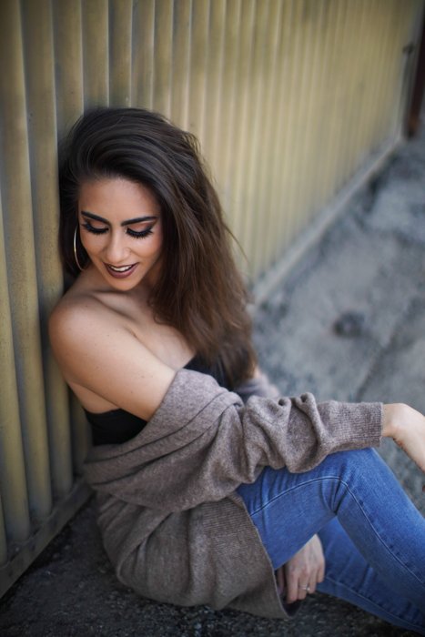 A female model posing outdoors shot with a Sony a7R III mirrorless camera