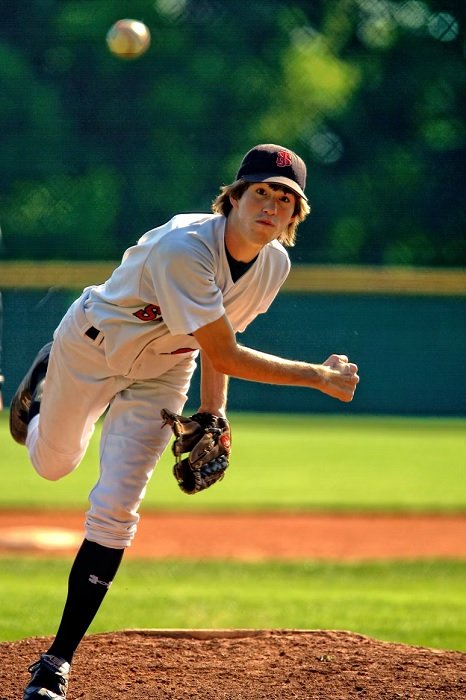 Baseball pitcher throwing a ball towards the camera