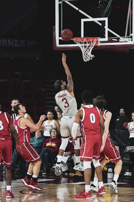 Basketball player shooting a two-pointer close to the net