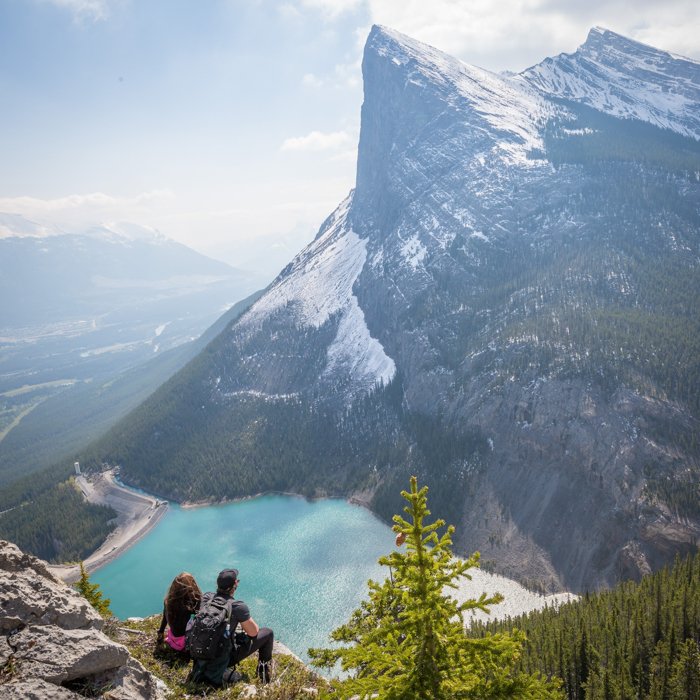 Image of travellers surrounded by a beautiful landscape