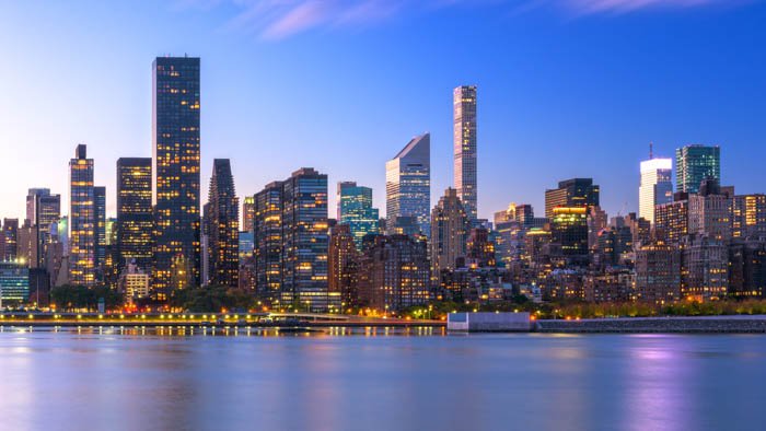 Cityscape image of New York City skyline of Midtown Manhattan from across the Hudson River.